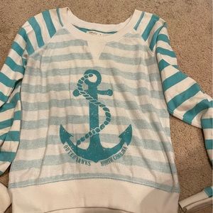 teal and white long sleeve shirt